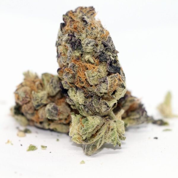 Black Cherry Punch cannabis flower featuring dense purple and green buds coated in frosty trichomes, known for its sweet cherry aroma and premium-quality appearance.