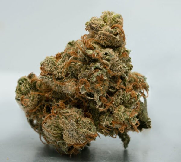 Banana Kush cannabis strain featuring dense green buds with orange pistils and a frosty trichome coating, known for its sweet banana aroma and premium flower quality.