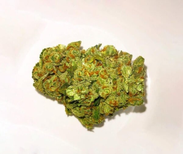 Blue Cheese cannabis strain with dense light-green buds, bright orange hairs, and a thick coating of frosty trichomes, showcasing the strain's distinctive appearance and premium quality.
