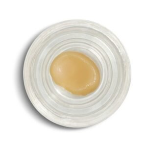 Golden wax cannabis concentrate close up